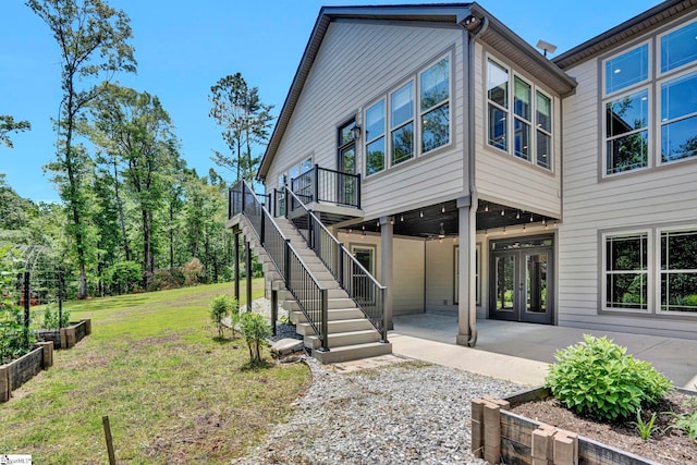 1061 Hidden Glory Dr, Landrum, SC 29356 - rear view of house with a lawn, french doors, a patio, stairway, and a wooden deck