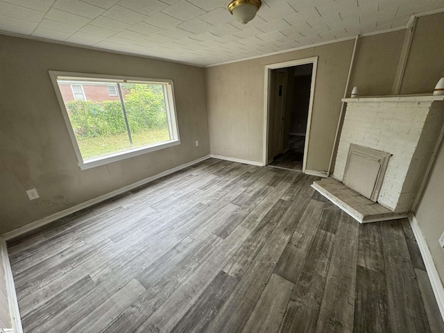 403 Duckett St, Laurens, SC 29360 - unfurnished living room featuring wood finished floors, crown molding, and baseboards