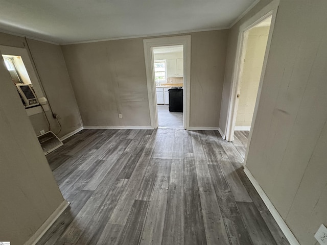 403 Duckett St, Laurens, SC 29360 - unfurnished living room featuring dark wood-style flooring, ornamental molding, and baseboards