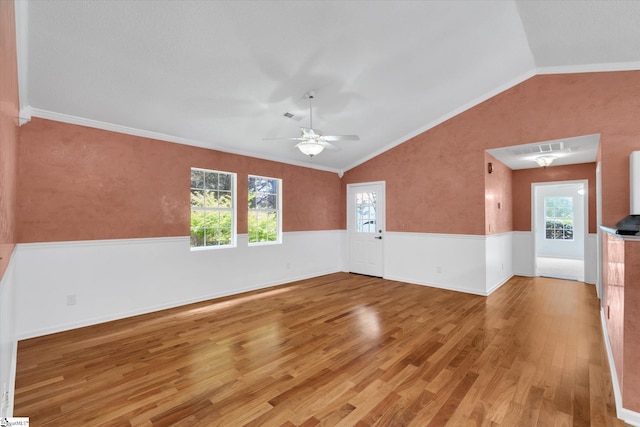 1783 Brockman Mcclimon Rd, Greer, SC 29651 - unfurnished room with light wood finished floors, lofted ceiling, healthy amount of natural light, a ceiling fan, and wainscoting