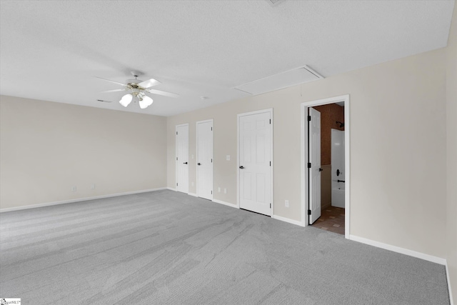 1783 Brockman Mcclimon Rd, Greer, SC 29651 - unfurnished bedroom featuring attic access, carpet floors, baseboards, two closets, and connected bathroom