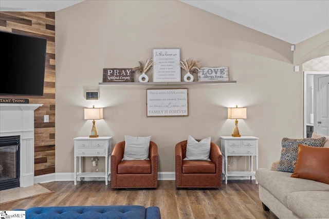124 Still Creek Ct, Easley, SC 29640 - living area featuring wood finished floors, vaulted ceiling, baseboards, and a fireplace with flush hearth