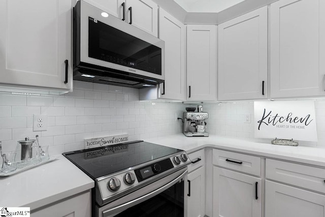 223 R C Thompson Rd, Chesnee, SC 29323 - kitchen with electric range, white cabinets, backsplash, and light countertops