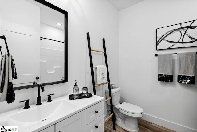 223 R C Thompson Rd, Chesnee, SC 29323 - bathroom featuring wood finished floors, vanity, toilet, and baseboards