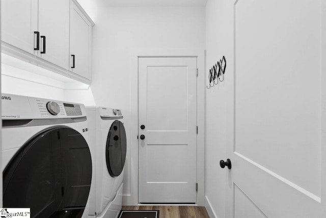 223 R C Thompson Rd, Chesnee, SC 29323 - laundry room with washer and dryer, cabinet space, and wood finished floors