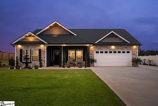 223 R C Thompson Rd, Chesnee, SC 29323 - craftsman-style home featuring stone siding, concrete driveway, a garage, roof with shingles, and a porch