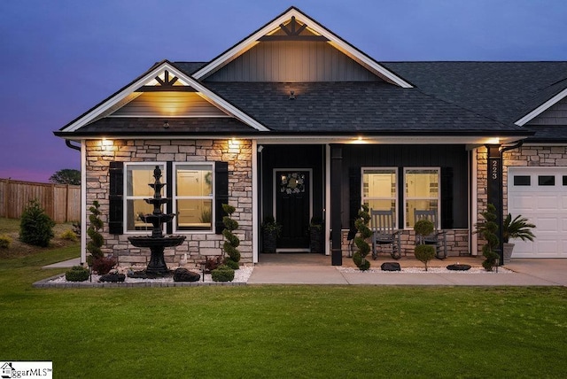 223 R C Thompson Rd, Chesnee, SC 29323 - craftsman house featuring stone siding, a shingled roof, board and batten siding, a porch, and a garage