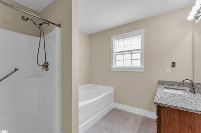 7 Slate Ln, Greer, SC 29650 - bathroom with vanity, a bath, baseboards, a shower, and wood finished floors