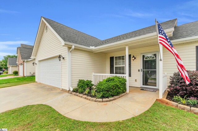 7 Slate Ln, Greer, SC 29650 - view of front of property featuring a porch, concrete driveway, an attached garage, and a shingled roof