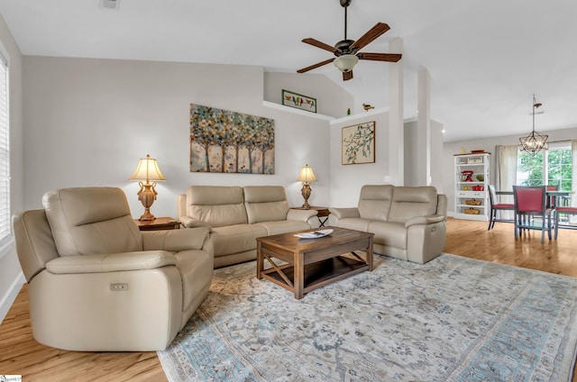 7 Slate Ln, Greer, SC 29650 - living area with wood finished floors, a ceiling fan, vaulted ceiling, a chandelier, and baseboards