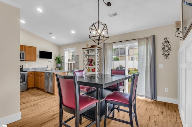7 Slate Ln, Greer, SC 29650 - dining space with light wood-type flooring, baseboards, lofted ceiling, a chandelier, and recessed lighting