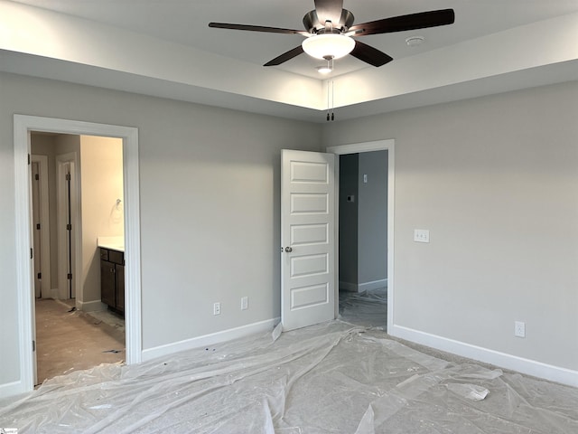 213 Fenner Pl, Greenville, SC 29607 - unfurnished bedroom featuring baseboards, connected bathroom, and ceiling fan