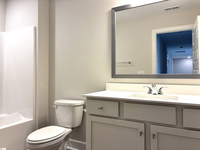 213 Fenner Pl, Greenville, SC 29607 - full bathroom featuring toilet, vanity, baseboards, and shower / bathtub combination with curtain