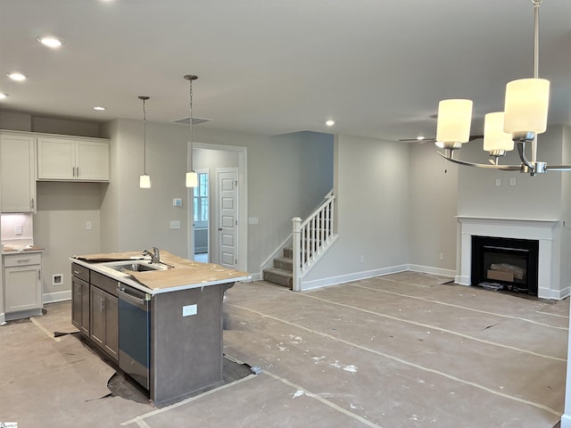 213 Fenner Pl, Greenville, SC 29607 - kitchen featuring a sink, recessed lighting, open floor plan, baseboards, and stainless steel dishwasher