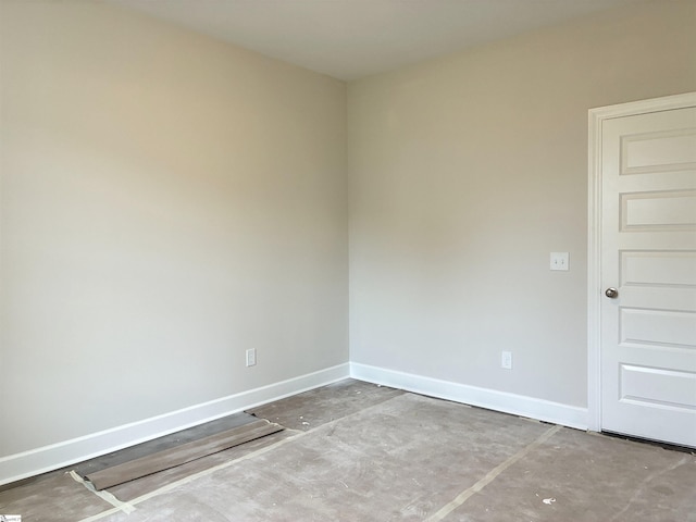 213 Fenner Pl, Greenville, SC 29607 - spare room featuring baseboards and concrete flooring