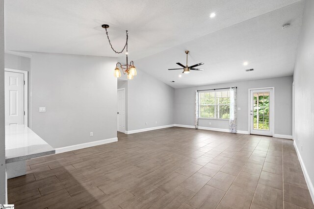 3 Alewine Ct, Taylors, SC 29687 - unfurnished living room featuring a chandelier, ceiling fan, baseboards, vaulted ceiling, and wood finished floors