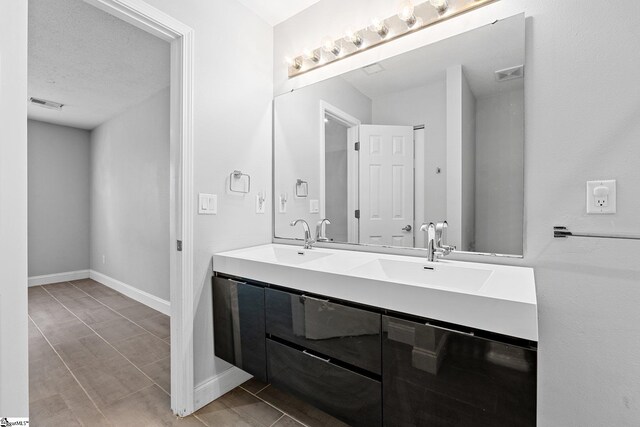 3 Alewine Ct, Taylors, SC 29687 - full bath featuring double vanity, baseboards, and a textured ceiling