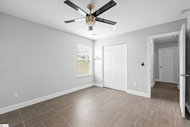 3 Alewine Ct, Taylors, SC 29687 - unfurnished bedroom featuring baseboards, wood finish floors, a closet, attic access, and a ceiling fan