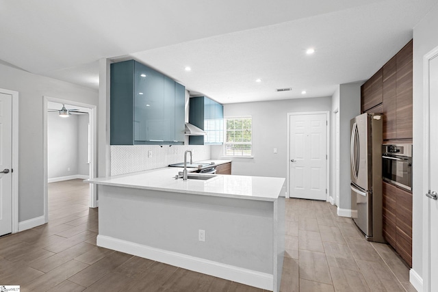 3 Alewine Ct, Taylors, SC 29687 - kitchen with appliances with stainless steel finishes, light countertops, light wood-style flooring, modern cabinets, and a peninsula