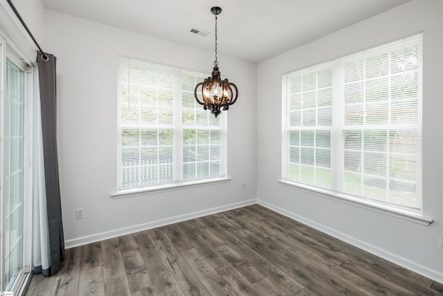 16 Glenbow Ct, Simpsonville, SC 29680 - unfurnished dining area with a chandelier, dark wood-style flooring, and baseboards
