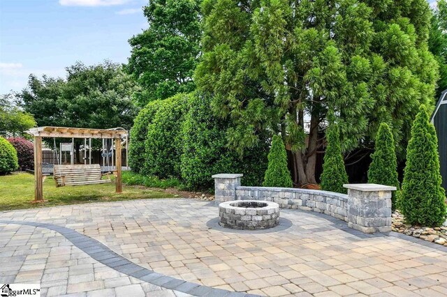 16 Glenbow Ct, Simpsonville, SC 29680 - view of patio featuring an outdoor fire pit and a pergola