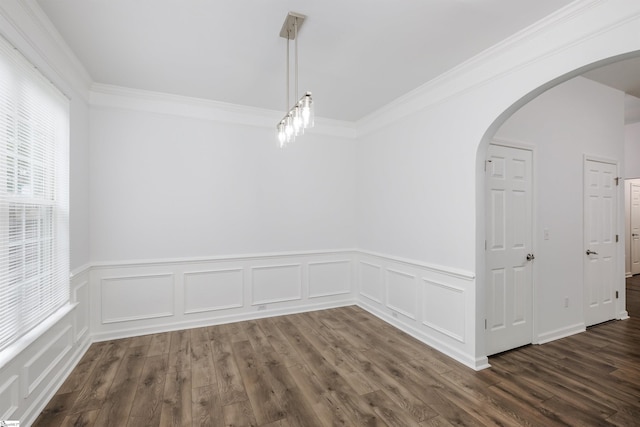 16 Glenbow Ct, Simpsonville, SC 29680 - empty room featuring arched walkways, a wainscoted wall, crown molding, dark wood-type flooring, and a decorative wall