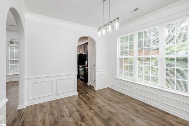 16 Glenbow Ct, Simpsonville, SC 29680 - unfurnished dining area with ornamental molding, arched walkways, a decorative wall, dark wood-type flooring, and wainscoting