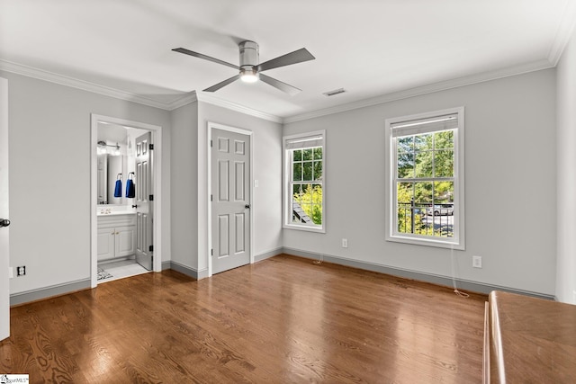 213 Old House Way, Simpsonville, SC 29681 - unfurnished bedroom with wood finished floors, crown molding, baseboards, connected bathroom, and ceiling fan