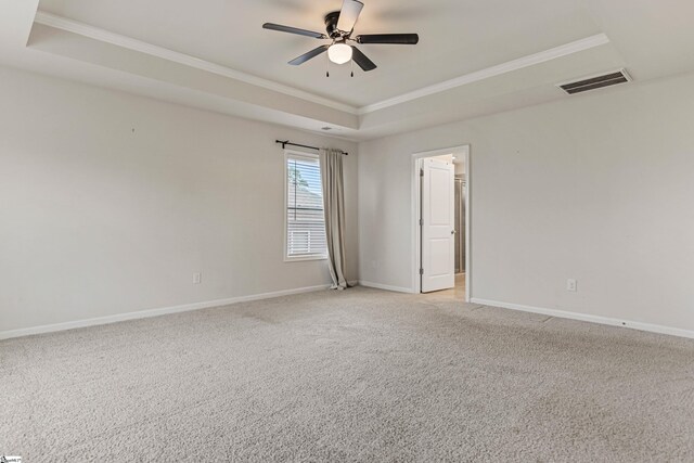 122 Rivermill Pl, Piedmont, SC 29673 - empty room with a tray ceiling, ornamental molding, baseboards, ceiling fan, and light carpet
