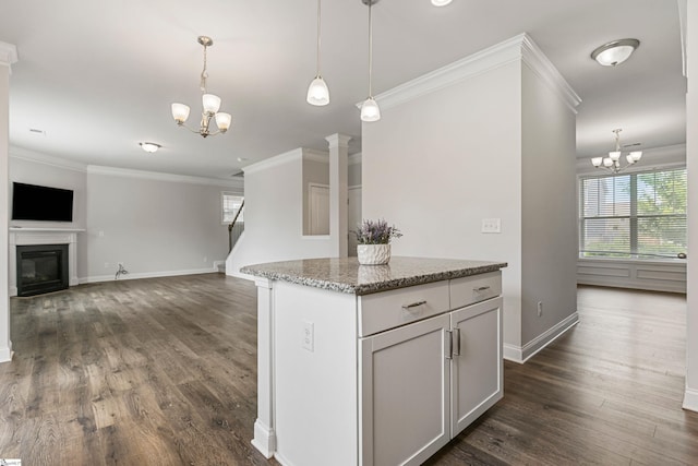 122 Rivermill Pl, Piedmont, SC 29673 - kitchen with a chandelier, healthy amount of natural light, dark wood-type flooring, ornamental molding, and hanging light fixtures