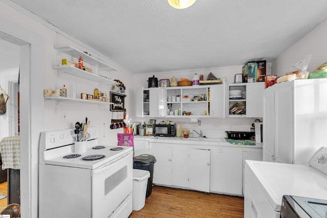 2413 Andrews Rd, Spartanburg, SC 29302 - kitchen with open shelves, white electric range oven, washer / clothes dryer, black microwave, and light wood finished floors