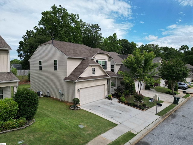 207 Penrith Ct, Simpsonville, SC 29681 - traditional home featuring driveway, roof with shingles, a front lawn, and central AC