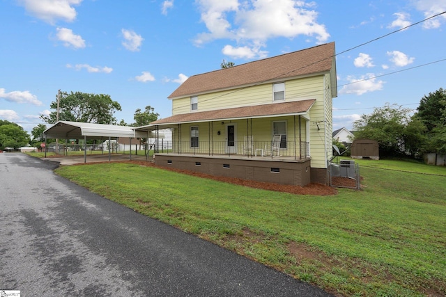 1 Baldwin St, Pelzer, SC 29669 - farmhouse with a detached carport, a porch, crawl space, a front yard, and a shingled roof
