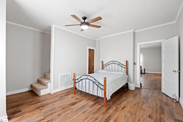 1 Baldwin St, Pelzer, SC 29669 - bedroom featuring wood finished floors, crown molding, baseboards, and a ceiling fan