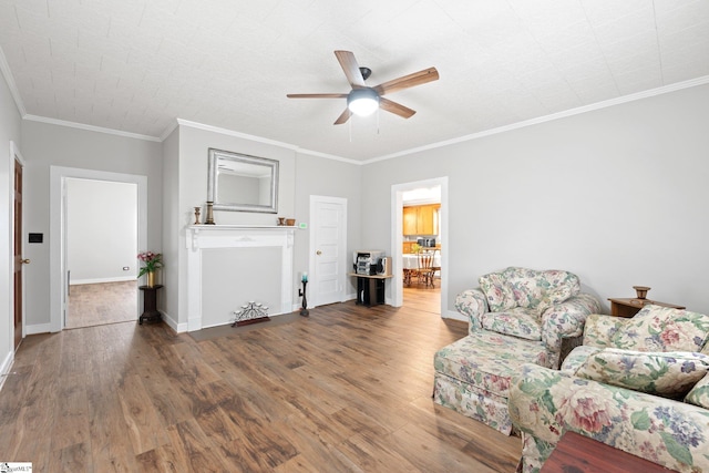 1 Baldwin St, Pelzer, SC 29669 - living area with ceiling fan, wood finished floors, baseboards, and crown molding