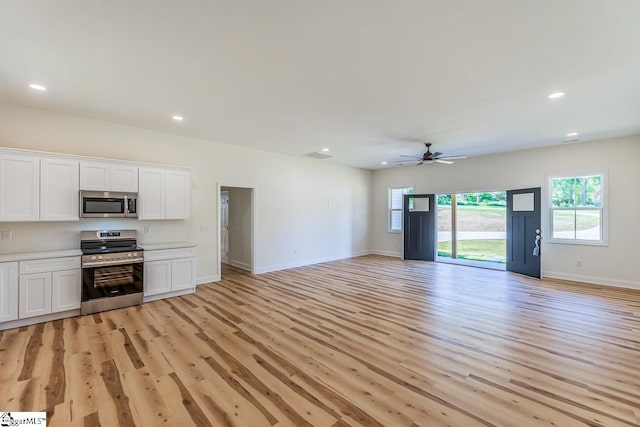 411 Wyatt Rd, Piedmont, SC 29673 - unfurnished living room with a ceiling fan, light wood-style floors, recessed lighting, and baseboards