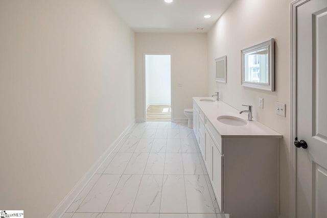 411 Wyatt Rd, Piedmont, SC 29673 - bathroom featuring marble finish flooring, toilet, double vanity, recessed lighting, and baseboards
