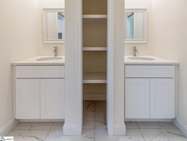 411 Wyatt Rd, Piedmont, SC 29673 - bathroom featuring marble finish flooring, vanity, and baseboards