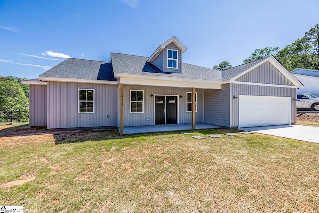 411 Wyatt Rd, Piedmont, SC 29673 - view of front of house featuring a garage, covered porch, a front yard, and a shingled roof