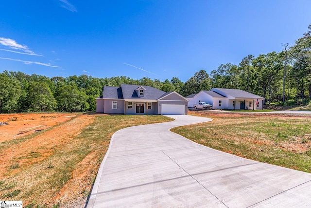411 Wyatt Rd, Piedmont, SC 29673 - view of front facade featuring a garage, a front lawn, and driveway