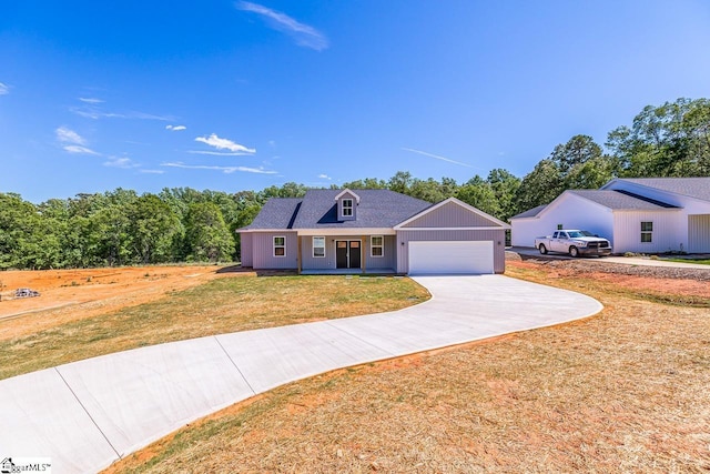 411 Wyatt Rd, Piedmont, SC 29673 - view of front facade featuring a garage, a front lawn, and driveway