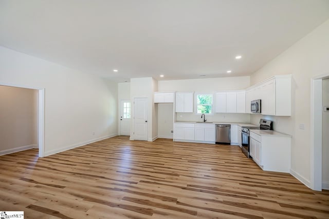 411 Wyatt Rd, Piedmont, SC 29673 - kitchen with stainless steel appliances, a sink, light wood-type flooring, healthy amount of natural light, and recessed lighting