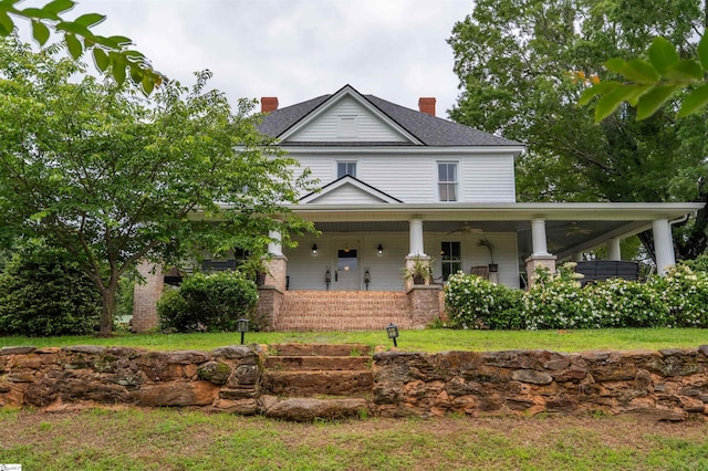 251 W Mcelhaney Rd, Taylors, SC 29687 - country-style home with a ceiling fan, covered porch, a chimney, and a front yard