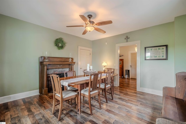 251 W Mcelhaney Rd, Taylors, SC 29687 - dining room featuring ceiling fan, wood finished floors, a fireplace, and baseboards