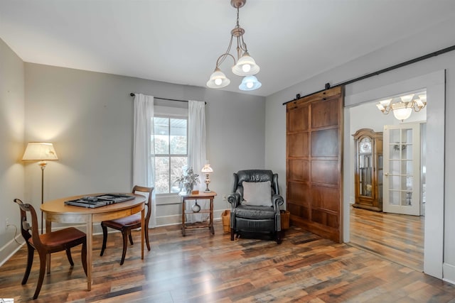 251 W Mcelhaney Rd, Taylors, SC 29687 - sitting room with a barn door, wood finished floors, a chandelier, and baseboards