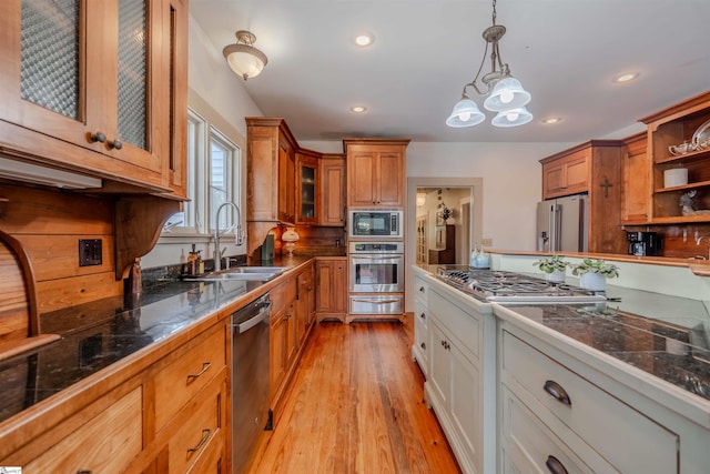 251 W Mcelhaney Rd, Taylors, SC 29687 - kitchen featuring stainless steel appliances, a sink, a warming drawer, brown cabinets, and glass insert cabinets