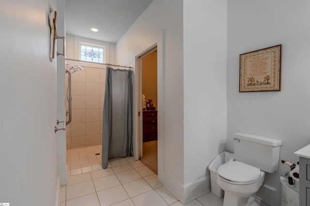 251 W Mcelhaney Rd, Taylors, SC 29687 - full bath featuring a tile shower, toilet, tile patterned flooring, and baseboards