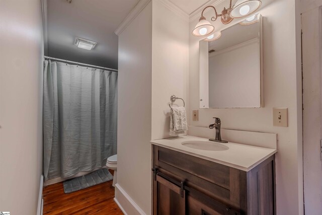 251 W Mcelhaney Rd, Taylors, SC 29687 - bathroom featuring crown molding, toilet, vanity, wood finished floors, and curtained shower