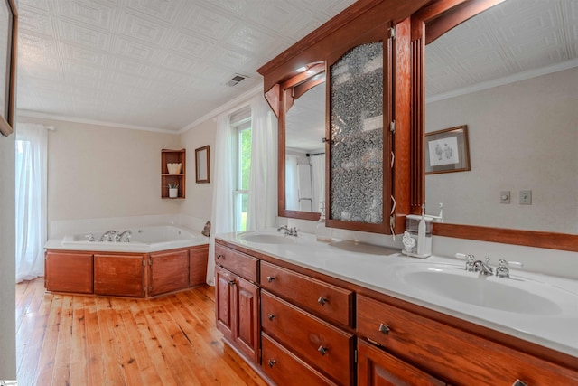 251 W Mcelhaney Rd, Taylors, SC 29687 - full bathroom featuring hardwood / wood-style floors, a garden tub, double vanity, crown molding, and an ornate ceiling
