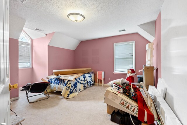 11 Midland Ct, Taylors, SC 29687 - carpeted bedroom with vaulted ceiling, a textured ceiling, and baseboards